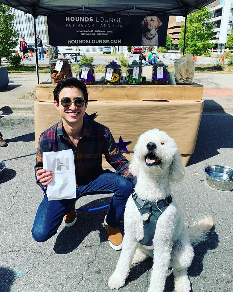 Dog outting to buy plenty of homemade treats from hounds lounge Dog stoping by Hounds Lounge festival tent to bug some homemade dog treats