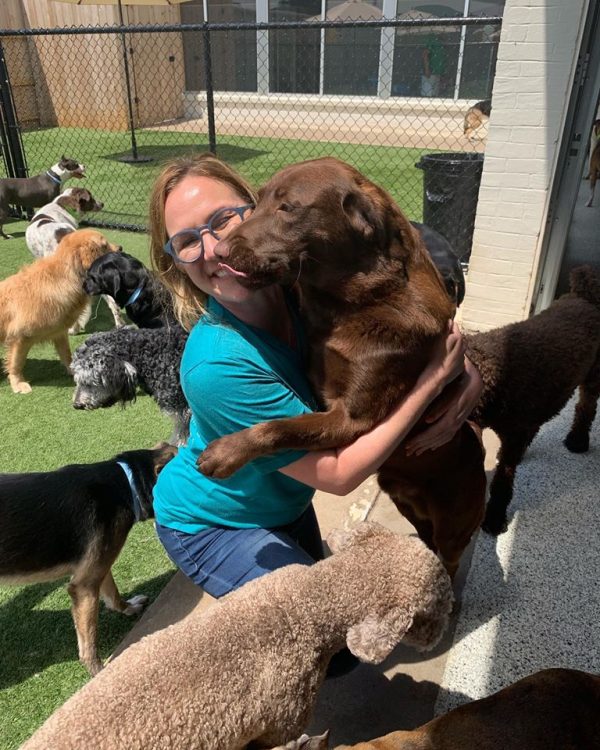 Human and Dog Hugs at Hounds Lounge Pet Resort