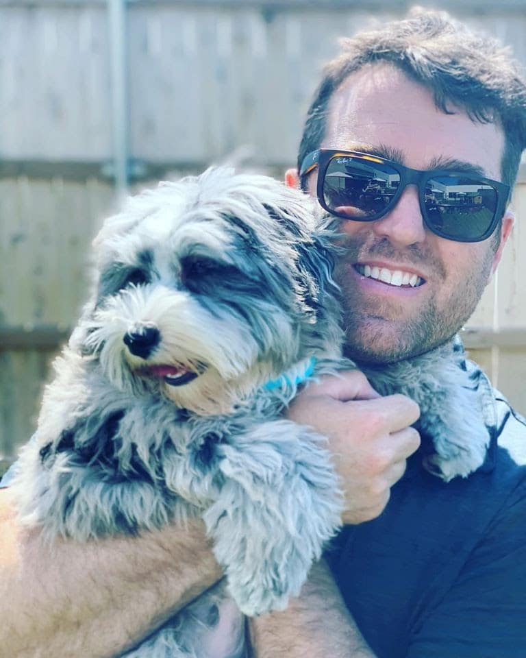 Justin with a beloved fur babe at Hounds Lounge fayetteville