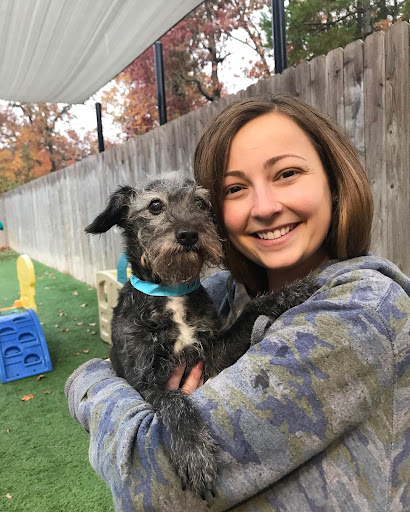 Worker Holding Puppy