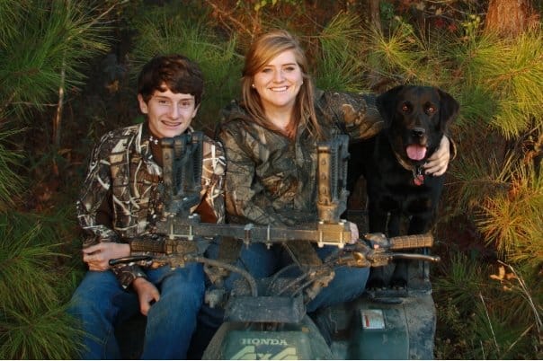 Kids with duck hunting dog