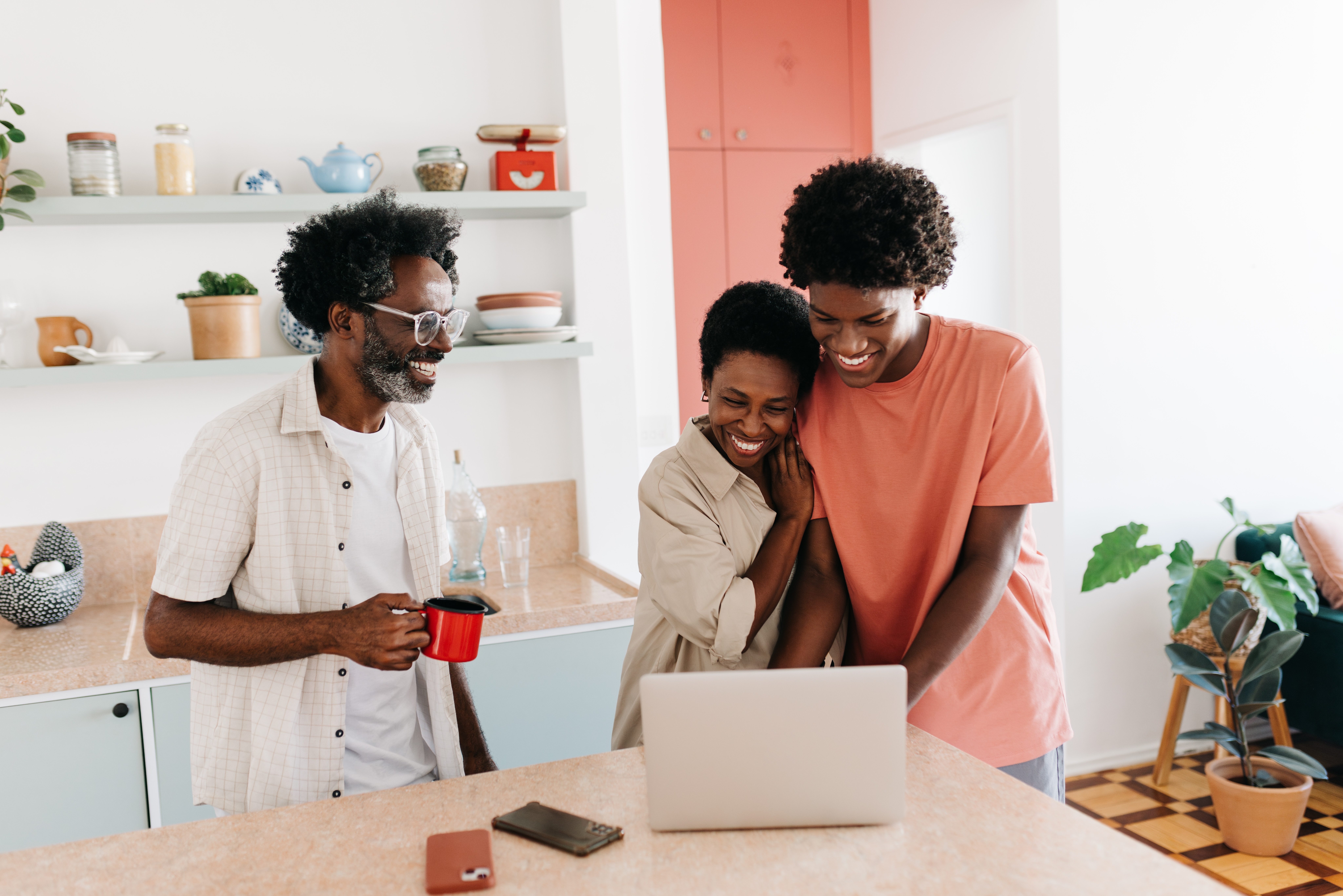 Teenage,Son,Uses,A,Laptop,With,His,Mother,And,Father