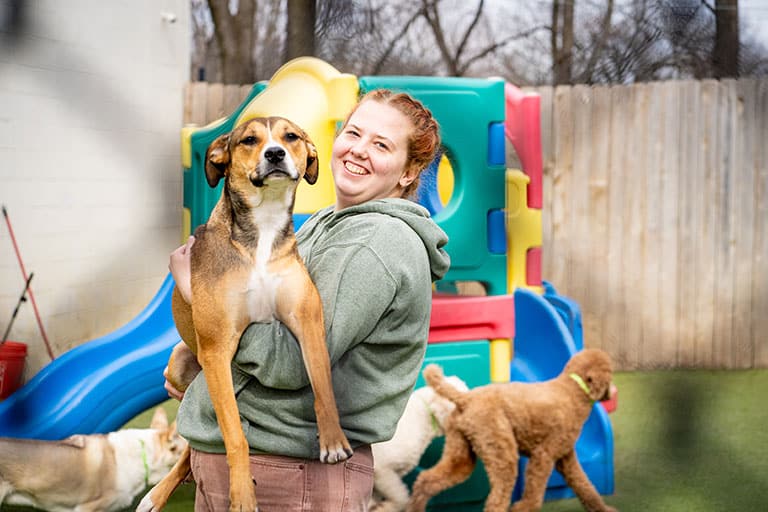 Happy woman posing with dog